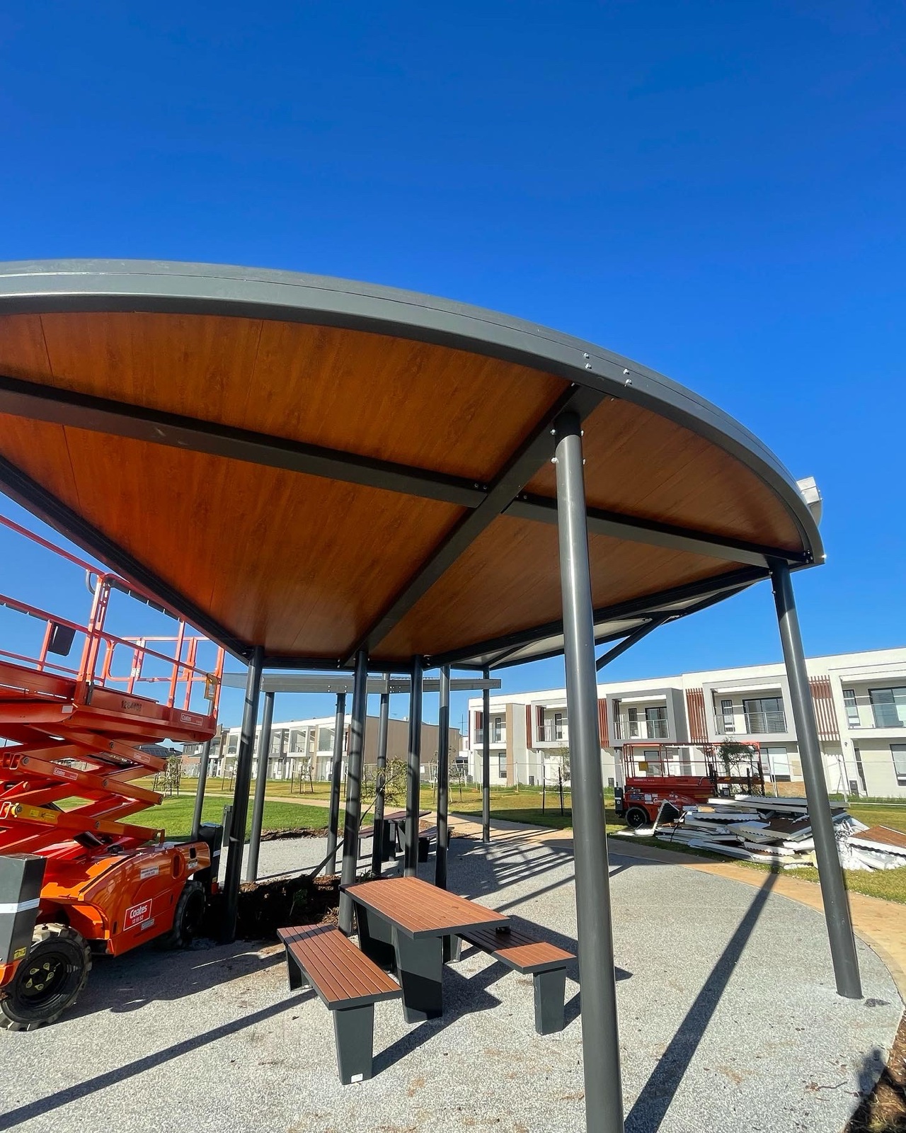Curved commercial pergola — Heasly & Son patios and pergolas Melbourne