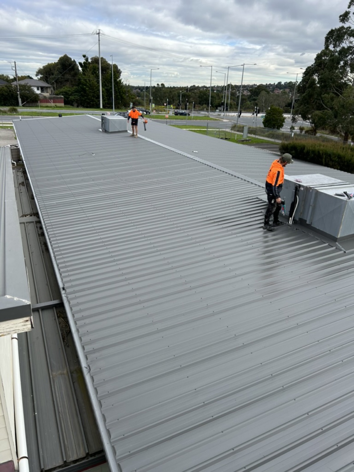 Department of Transport — crew on site — Heasly & Son commercial roofing Hallam Melbourne